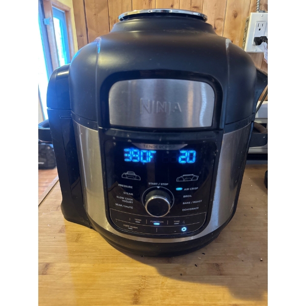 A Ninja Foodi 8-Qt, 9-in-1 Deluxe XL Pressure cooker and Air Fryer. Features TenderCrisp Technology,