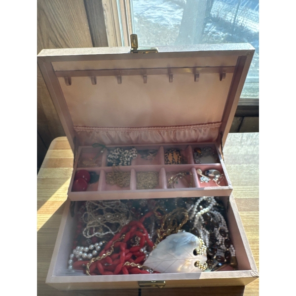 Jewelry box, all contents included. Costume jewelry mostly. 11 wide by eight deep by three and a hal