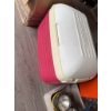 Image 1 : Orange plastic drawer organizer, a red and white cooler, two yellow handheld flashlights, a handheld