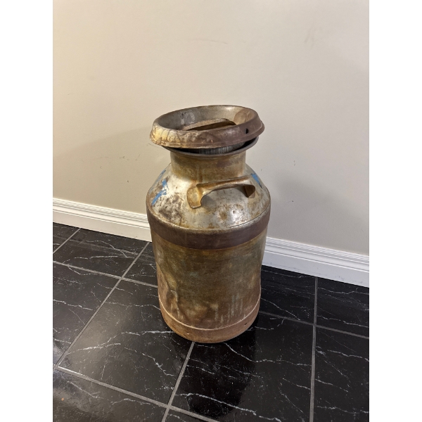 Original milk can  vintage metal milk can with a cylindrical body and a rounded lid.