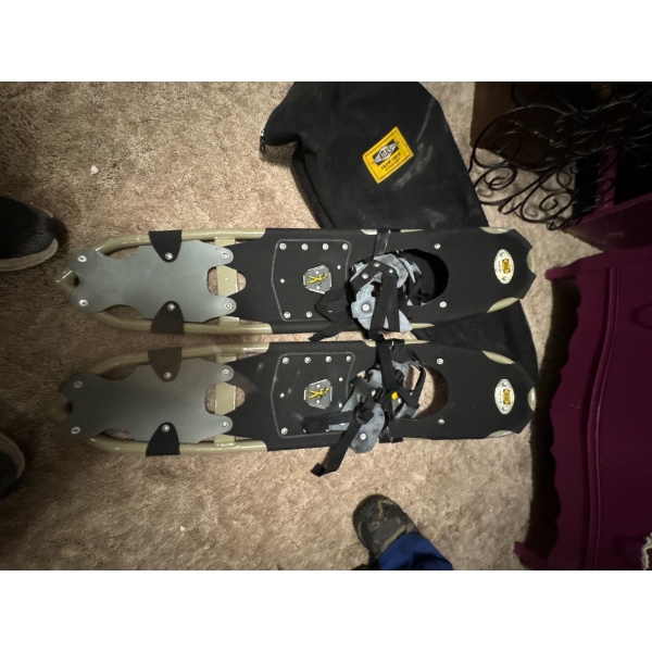  pair of Atlas snowshoes.  The snowshoes feature a durable aluminum frame 