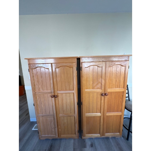 Two wooden cabinets or kitchen pantries, all contents included. Dimensions are 32 wide by 60 tall by