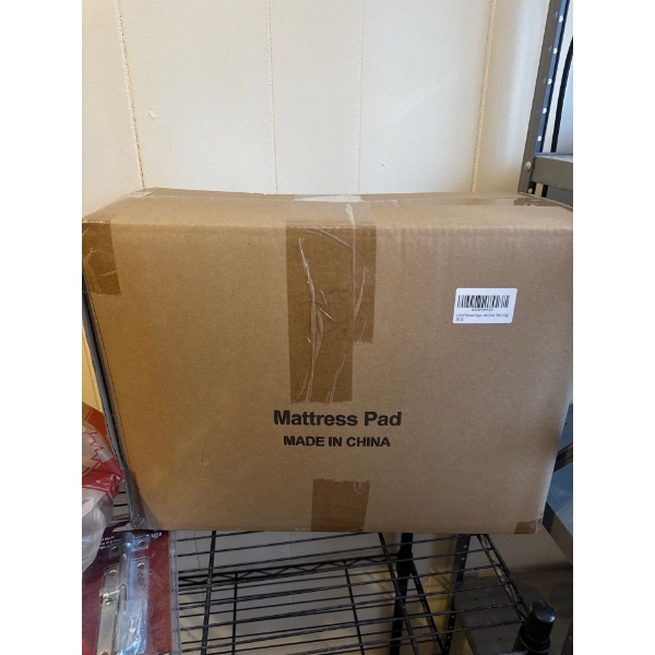 King mattress pad, unopened boxed. Contents, unknown.