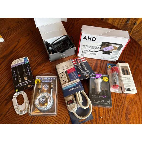 Garmin GPS, three brand new phone chargers, one car adapter, 3 piece car charger, one multiple plugi