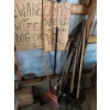 Image 1 : Pile of hand tools, including cardboard signs