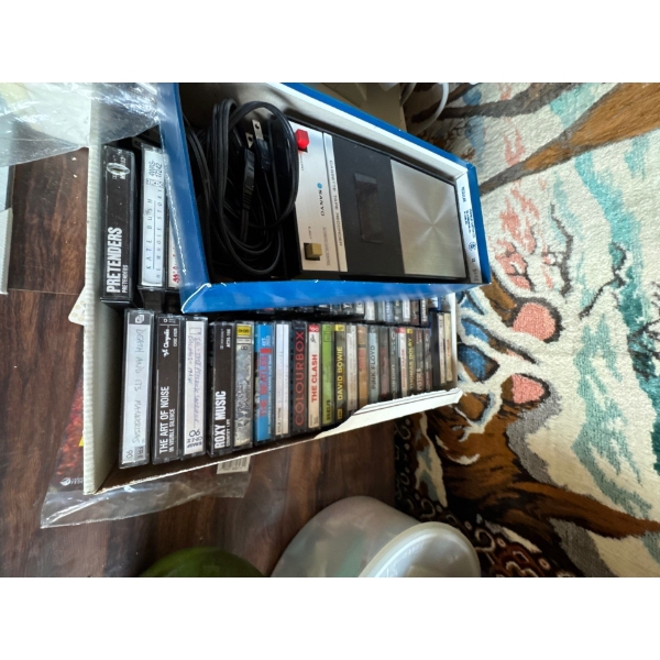 Vintage tape collection and cassette tape recorder. 