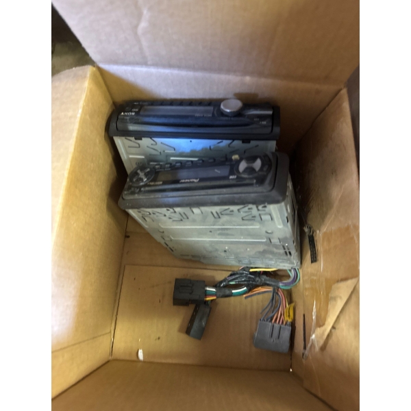 car stereo receivers, a Sony model and a Pioneer model, along with their wiring