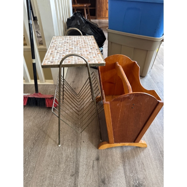 Two vintage magazine racks, one wood and one brass with retro top