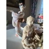 Image 3 : collection of various figurines, including a prominent brass or bronze dragon, a clear quartz or gla