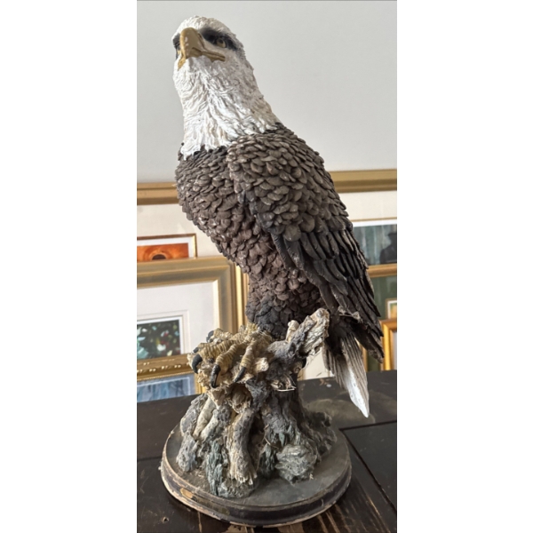  American Bald Eagle statue perched on a tree stump