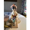 Image 5 : collection of various figurines, including a prominent brass or bronze dragon, a clear quartz or gla