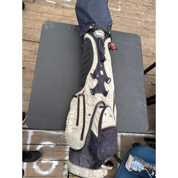 TITLEIST GOLF BAG FULL OF CLUBS AND DRIVERS AND ACCESORIES