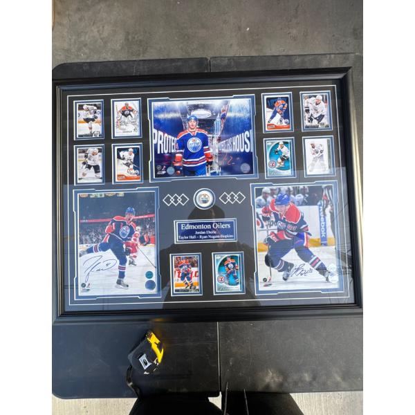 Framed autographed memorabilia containing personally autographed eight by 10 photo of Jordan Ebrele,