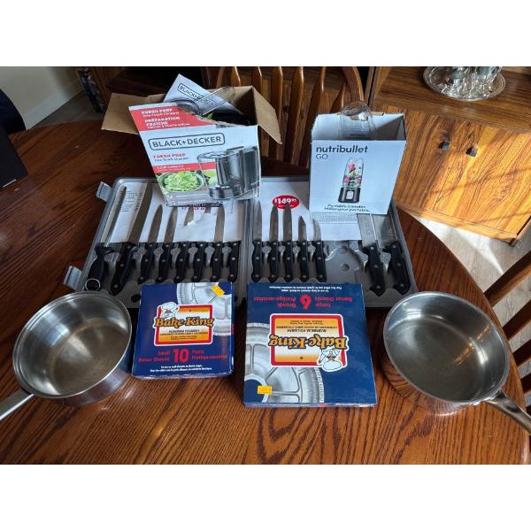 Two stainless steel pots, one set of 10 small Bake King burner guards, one set of 6 large Bake King 