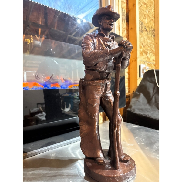BRONZE  cowboy statue. Nineteen inches talL