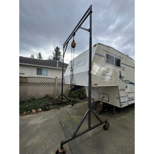 Heavy duty hoist adjustable. Five ton crane attached. Eight feet diameter inside by 13 feet high