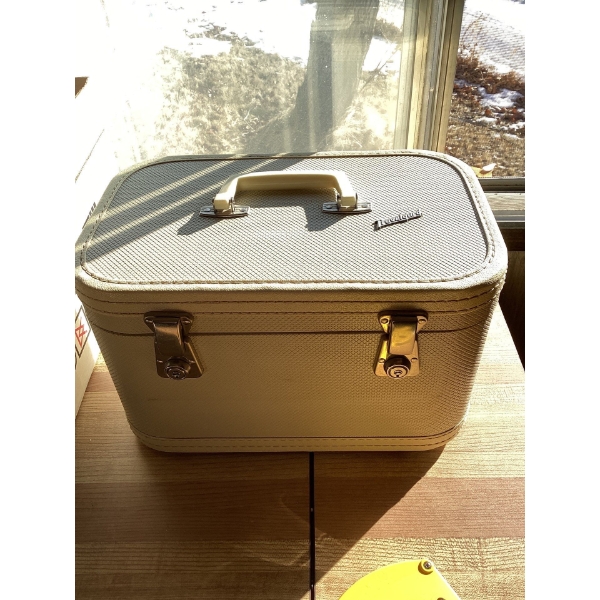 This is a vintage Travelgard train case, likely from the mid-20th century. unknown contents no key