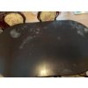 Image 3 : Dining set featuring an oval-shaped wooden table with dark finish and leaf extensions, accompanied b