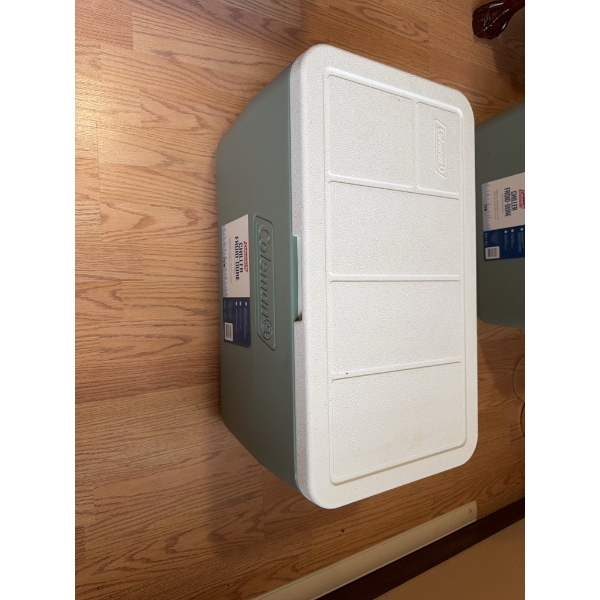 Coleman Chiller 48-quart cooler, constructed of durable hard plastic with a hinged lid. Features inc