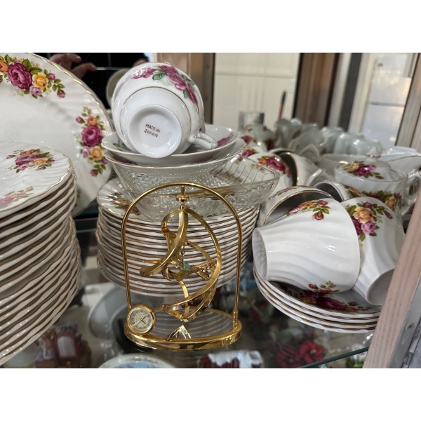   vintage gold-gilded porcelain made in Japan. 
unique, abstract gold-pated brass stand is designed 