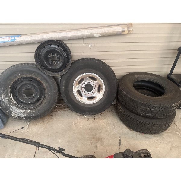 Miscellaneous tires, condition unknown, one rim from a Dodge truck, a spare rim, Michelin tire and a