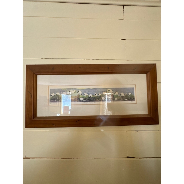 framed print of a watercolor painting featuring a flock of sheep, similar to works titled "Highland 