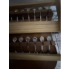 Image 2 : collection of souvenir or collectible spoons on a custom wooden display rack shaped like the contine