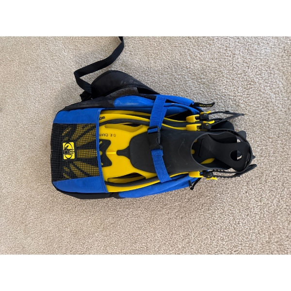 A set of yellow and black diving fins, a recreational water sport accessory for swimming