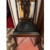 Image 4 : Wooden chair featuring a carved openwork backrest and a black vinyl upholstered seat. The chair has 