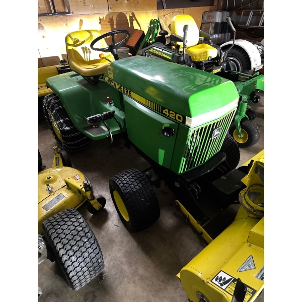 Second, John Deere with snowblower attachment and rototiller attachment. Very well maintained, almos