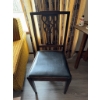 Image 1 : Wooden chair featuring a carved openwork backrest and a black vinyl upholstered seat. The chair has 