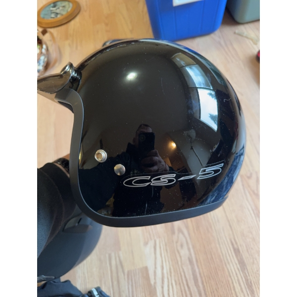 Black CS-5 motorcycle helmet with visor and a pair of black leather RoadTour gloves. The helmet feat