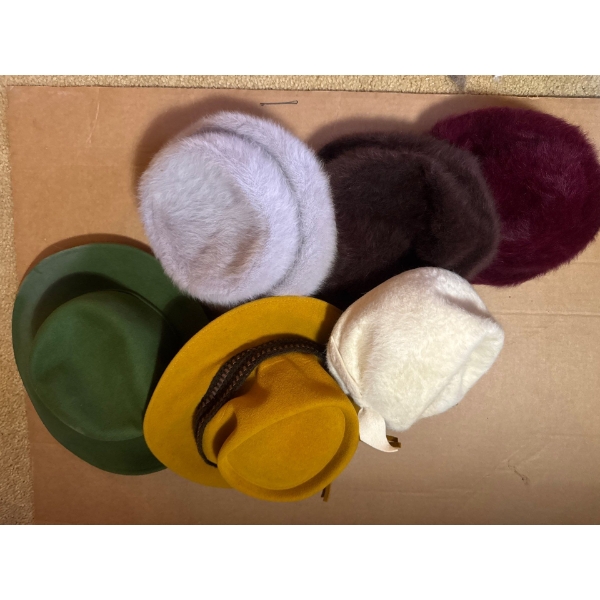 These are a collection of vintage wool and fur hats. 