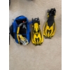 Image 3 : A set of yellow and black diving fins, a recreational water sport accessory for swimming