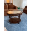 Image 1 :  vintage-style side table features a classic round marble top set within a dark wood frame supported