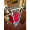 Image 1 : Nice metal storage rack with wood top, red rugs on shelves included, the dimensions are 16in wide, 5