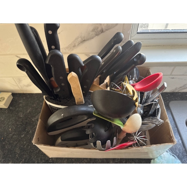 Kitchen knives, two kitchen knife holders, silverware forks, knifes and spoons, as well as whisks an