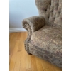 Image 4 : #2 traditional-style armchair featuring a tufted wingback design, rolled arms, and decorative nailhe