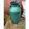 Image 2 : Two metal milk cans. One is decorated with hand-painted flower designs, and the other is solid green