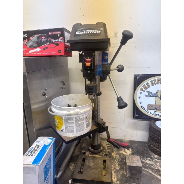Mastercraft 10 inch drill press with bucket full of drill bits and chucks