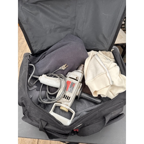 Travel bag with various items, power drill, and more.
