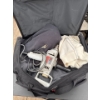 Image 1 : Travel bag with various items, power drill, and more.