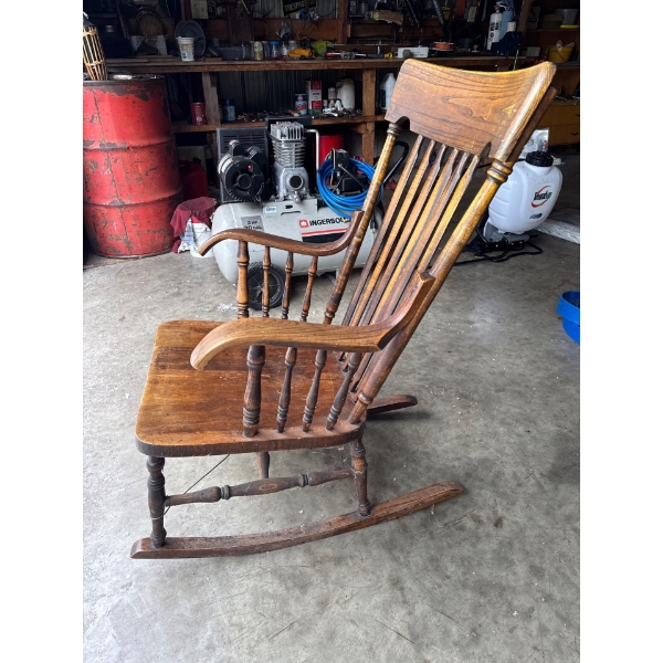 Very nice wood rocking chair.