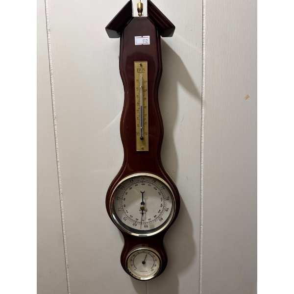 Wm. Widdop mahogany banjo weather station featuring a barometer, thermometer, and hygrometer. 
It is
