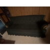Image 2 : Three-seat sofa with dark patterned upholstery, featuring rolled arms and wooden trim accents. The s