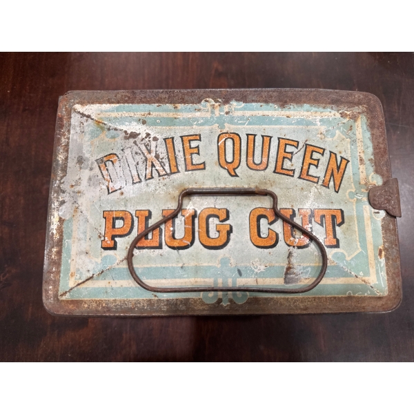  vintage Dixie Queen Plug Cut tobacco tin, often used as a lunch box in the late 19th or early 20th 