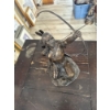 Image 1 : bronze sculpture titled "Starshooter," created by artist Lincoln Fox and often produced by the Fran