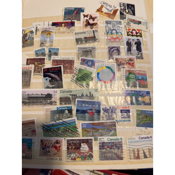 Canadian postage stamps housed in three albums, featuring a variety of commemorative, definitive, an