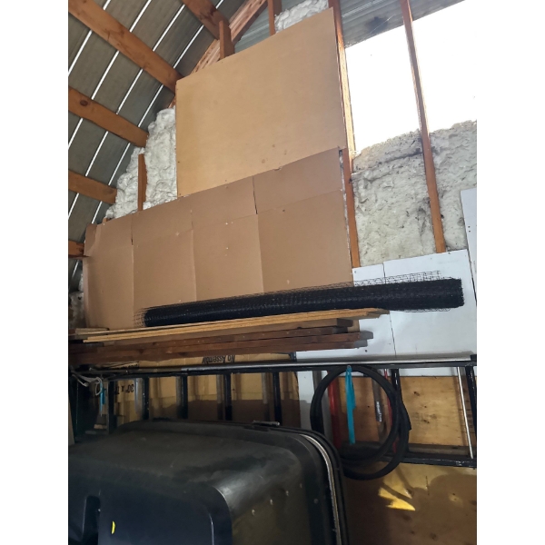 Pile of two by sixes and vinyl fencing material. Six foot fencing material.