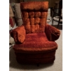 Image 7 : One blue fabric sofa with wood trim and one orange upholstered armchair with tufted back and wide ar